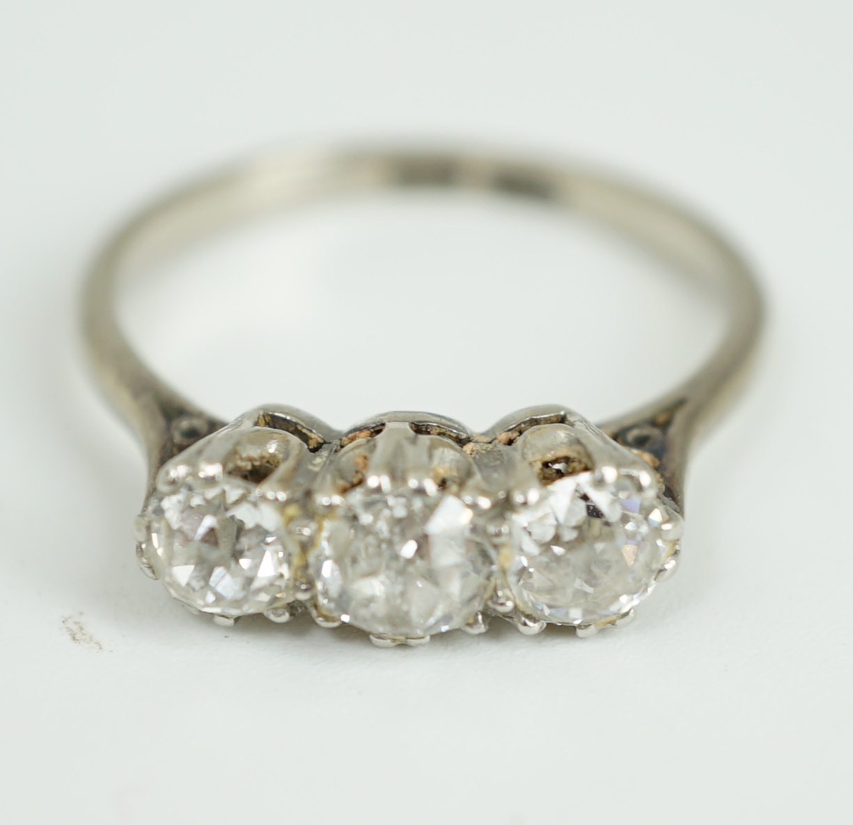 An 18ct white gold, platinum and three stone diamond set ring